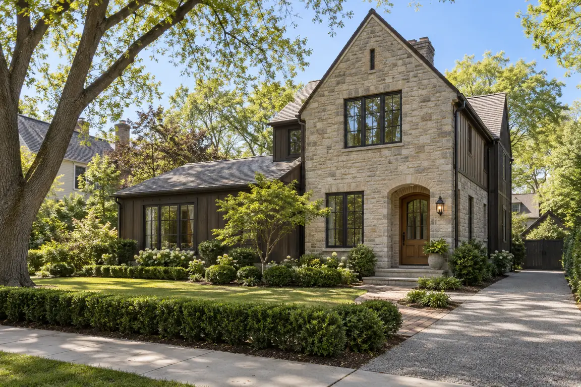 Stone home with a front walk and a side drive in Conway Farms, Lake Forest