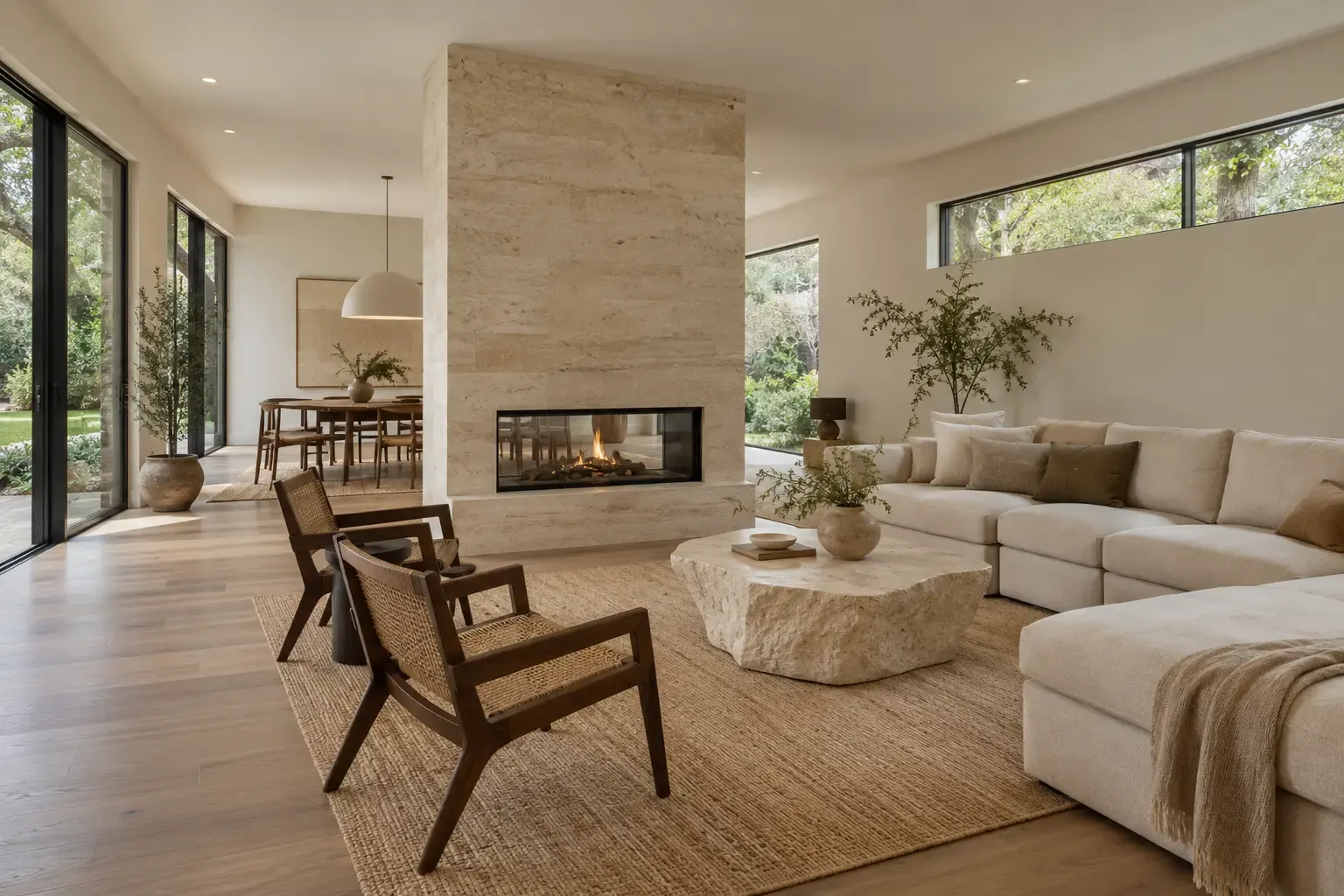 Open living room with a limestone fireplace in new construction homes in Lake Forest, IL